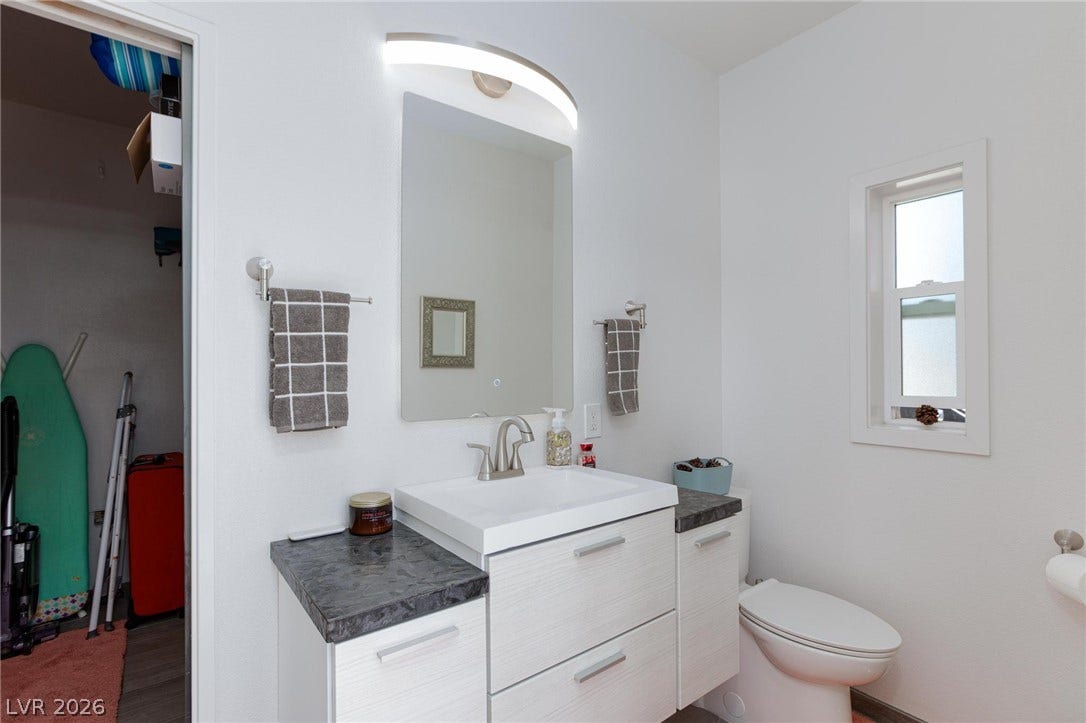 8175 Arville Street, #142, Las Vegas, NV 89139 Natural light from a single window brightens this sleek bathroom design.
