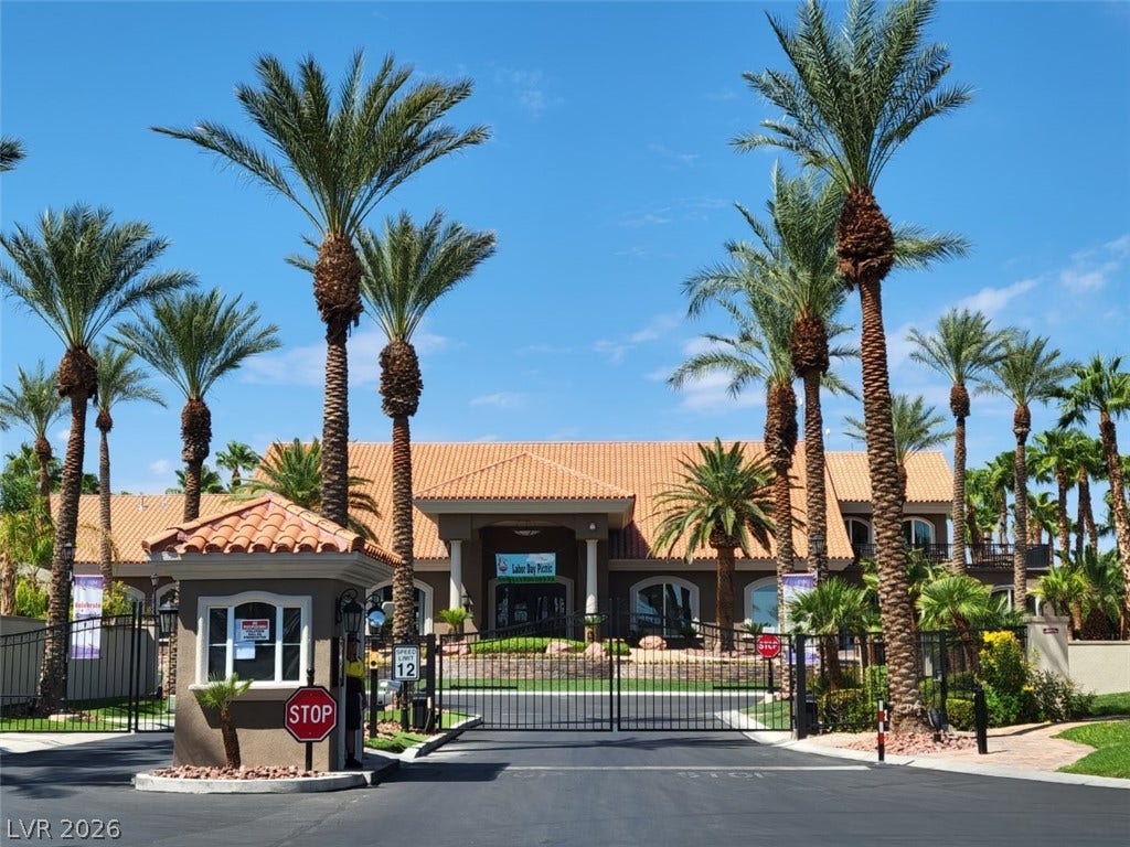 8175 Arville Street, #142, Las Vegas, NV 89139 Towering palm trees frame the gated entrance to this majestic community clubhouse.