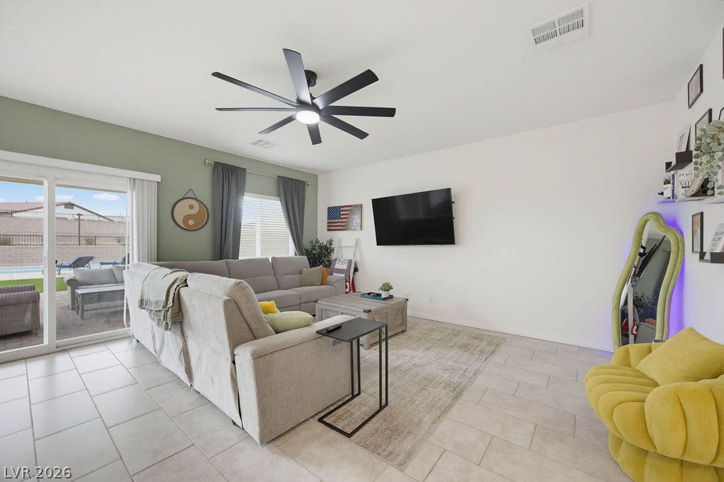 Sliding glass doors open directly to the patio from this open-concept living space.