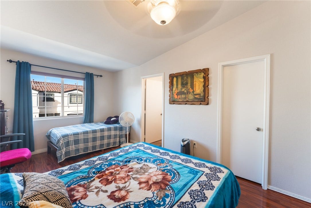 5330 E Charleston Boulevard, #123, Las Vegas, NV 89142 Gleaming wood floors anchor this comfortable bedroom complete with classic moldings and generous natural light.
