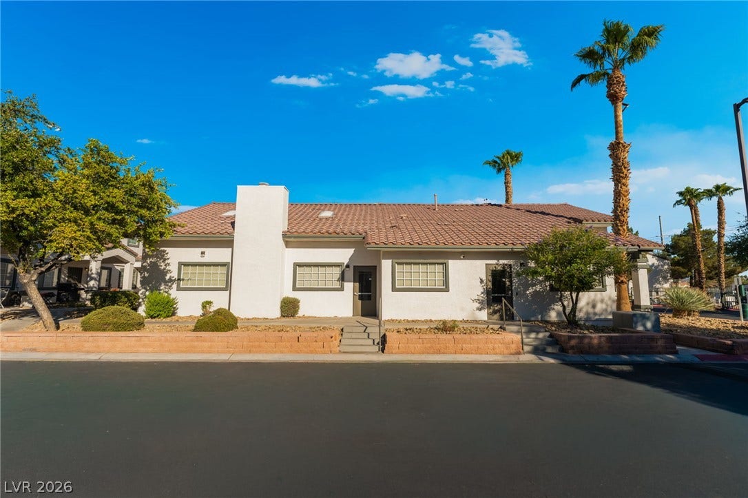 5330 E Charleston Boulevard, #123, Las Vegas, NV 89142 Spanish tile roofing and classic stucco detailing highlight this single-level exterior design.