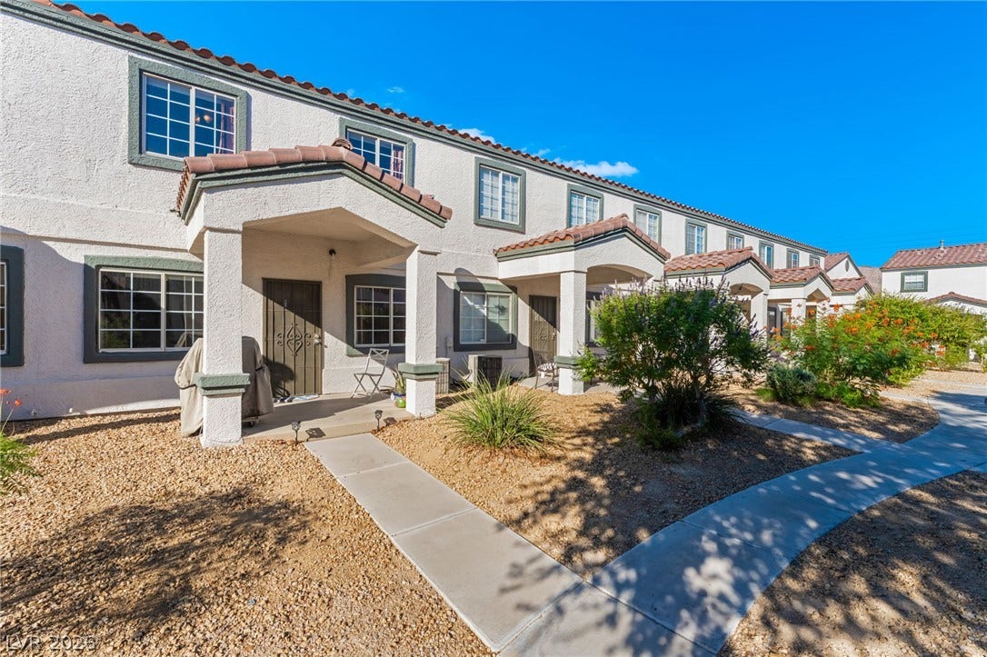 5330 E Charleston Boulevard, #123, Las Vegas, NV 89142 Concrete walkways lead to covered entryways of this stucco exterior townhome complex.