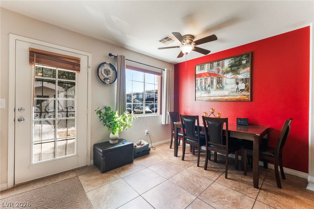 5330 E Charleston Boulevard, #123, Las Vegas, NV 89142 Tile flooring and classic French doors elevate this inviting dining space.