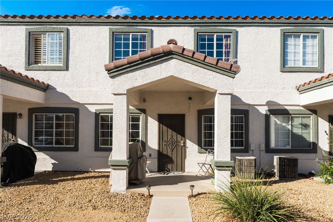 5330 E Charleston Boulevard, #123, Las Vegas, NV 89142 Spanish tile rooflines and stucco siding define this classic multi-level residence exterior.