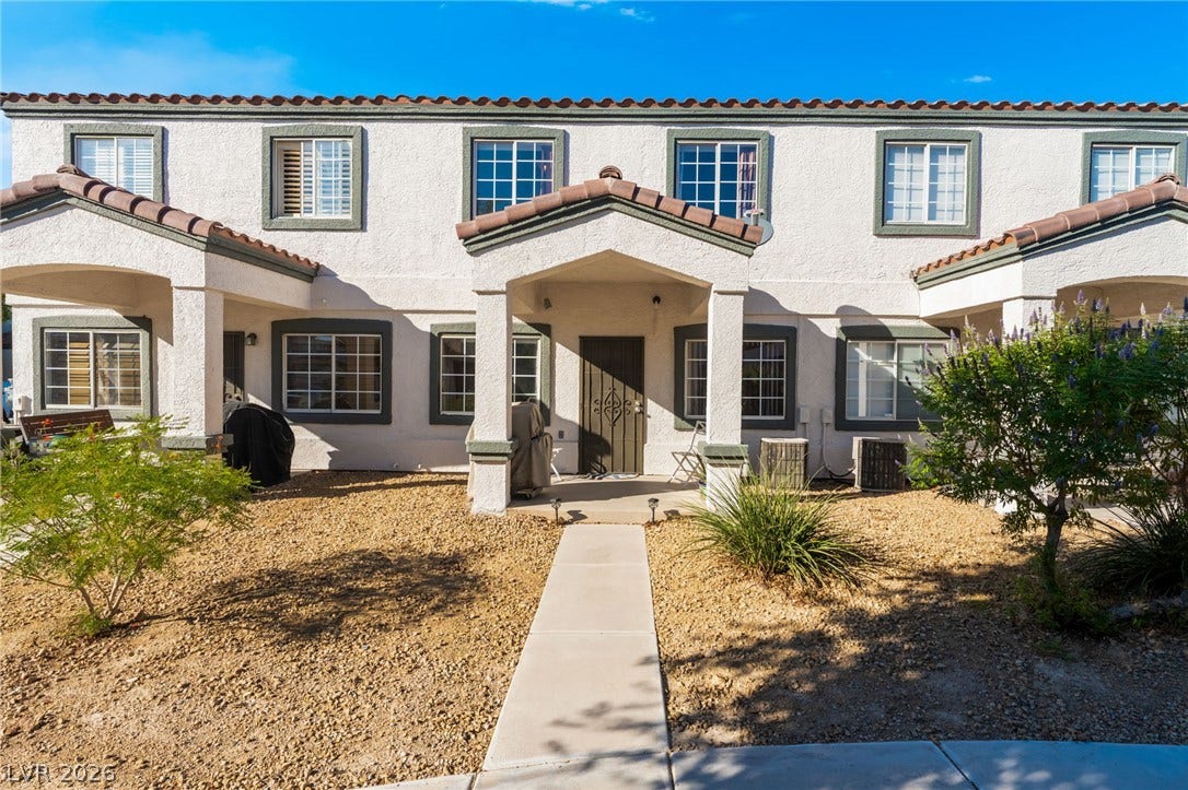 5330 E Charleston Boulevard, #123, Las Vegas, NV 89142 A neat concrete walkway leads directly to the covered entryway of this classic stucco exterior.