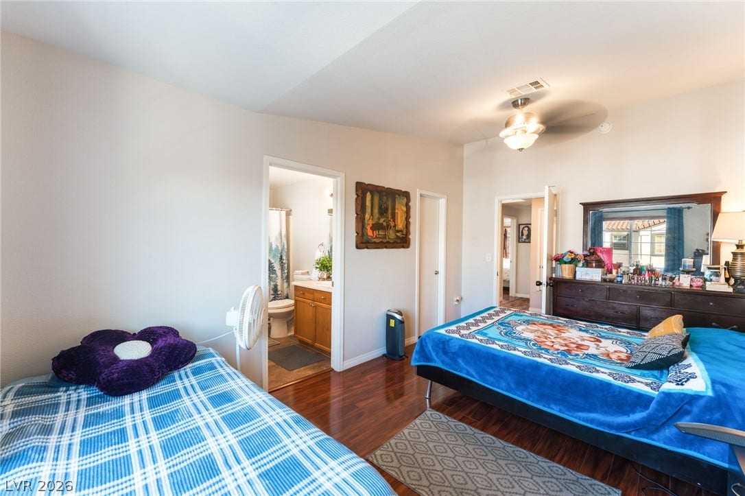 5330 E Charleston Boulevard, #123, Las Vegas, NV 89142 Rich hardwood flooring anchors this versatile bedroom suite featuring a private adjoining bath.