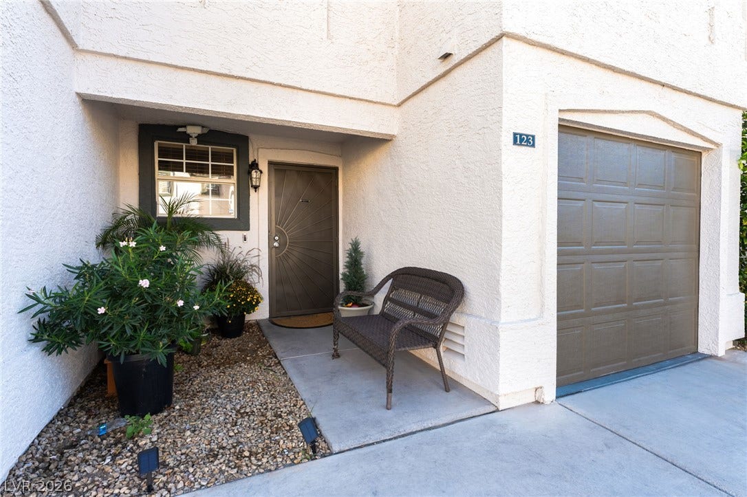 5330 E Charleston Boulevard, #123, Las Vegas, NV 89142 Stucco exterior finishes and an attached garage frame this inviting private entrance.