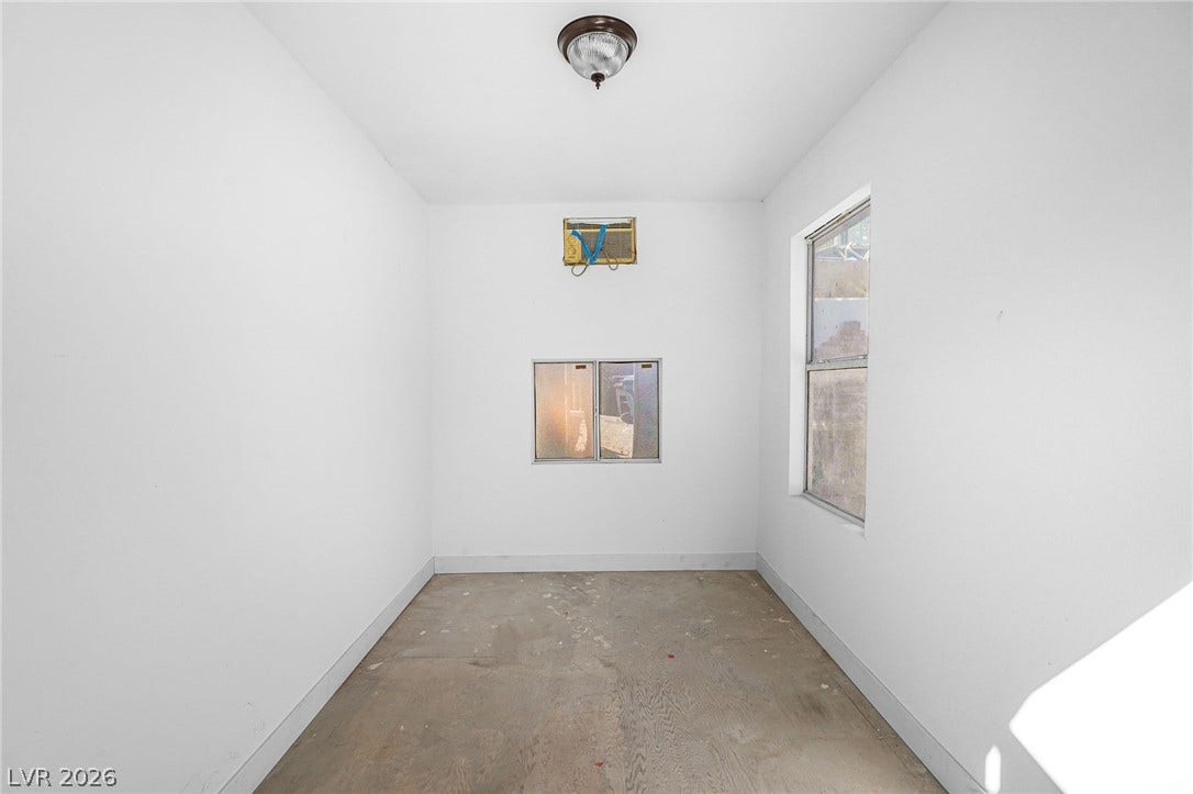 Natural light streams through multiple windows in this versatile, unfinished bonus space.