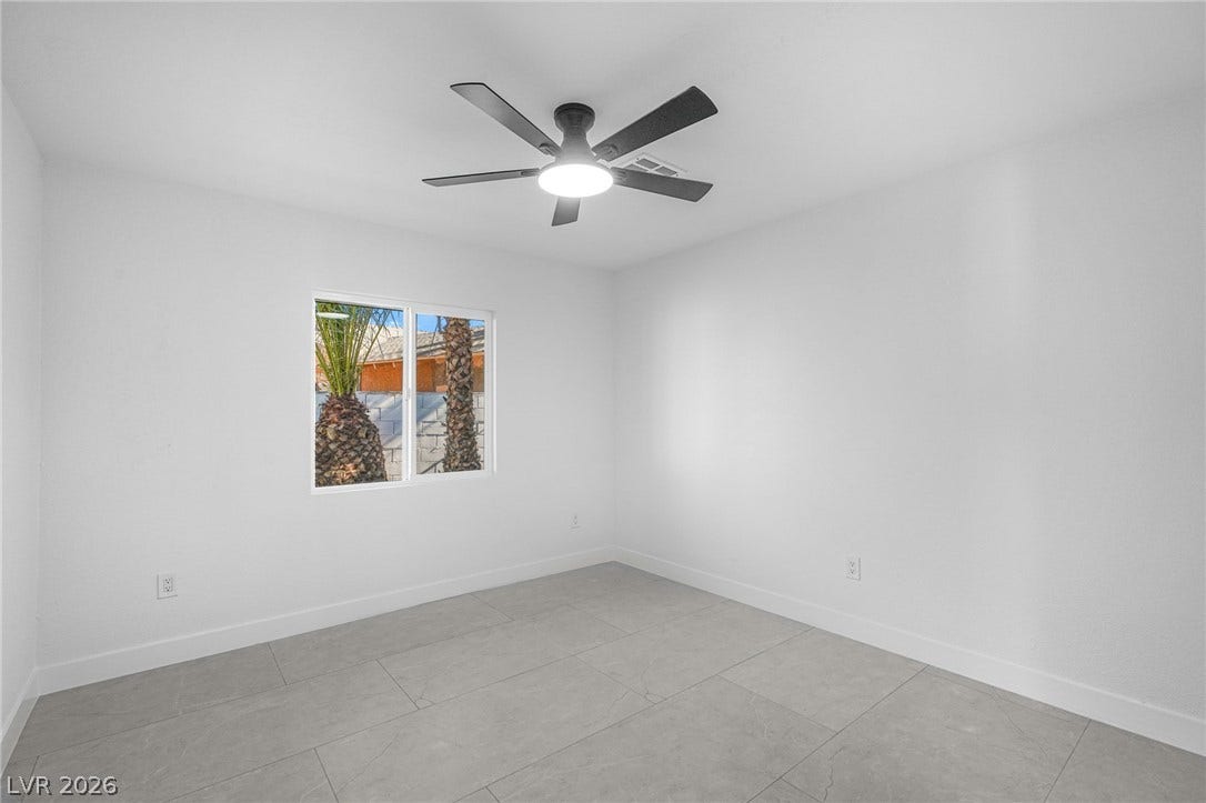Clean lines and stone tile flooring define this minimalist interior space.