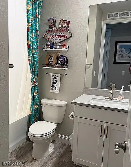 2126 Albury Avenue, North Las Vegas, NV 89086 A modern vanity with stone counters complements the neutral-toned bathroom.
