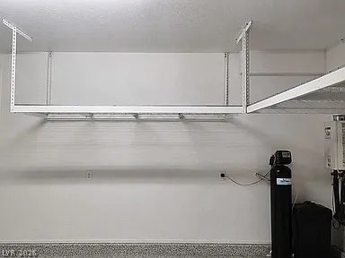 2126 Albury Avenue, North Las Vegas, NV 89086 Ample overhead storage racks and specialized utility systems maximize the utility of this clean garage.