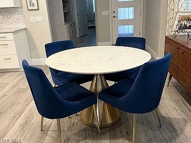 2126 Albury Avenue, North Las Vegas, NV 89086 Gleaming wood-look floors anchor a bright dining area seamlessly connected to the kitchen.