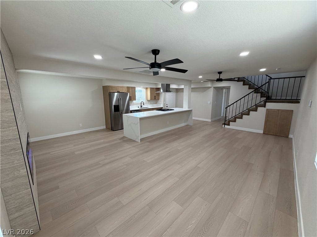 500 Grimsby Avenue, Henderson, NV 89014 A spacious open-concept interior seamlessly connects the modern kitchen with the versatile living area.