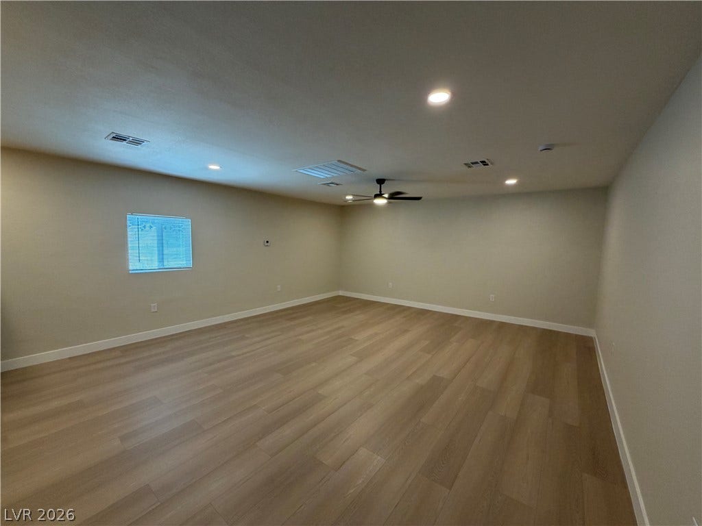 500 Grimsby Avenue, Henderson, NV 89014 Smooth wood floors and recessed lighting anchor this flexible, open living area.