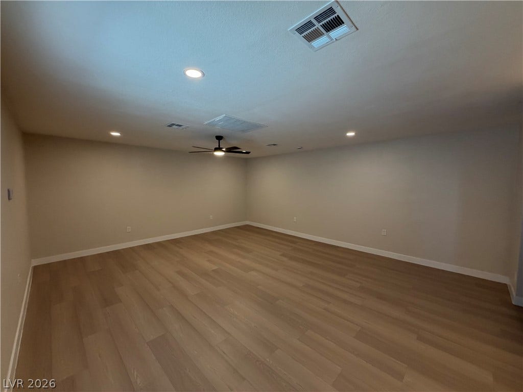 500 Grimsby Avenue, Henderson, NV 89014 Smooth wood-look flooring and recessed lighting define this versatile, open living area.