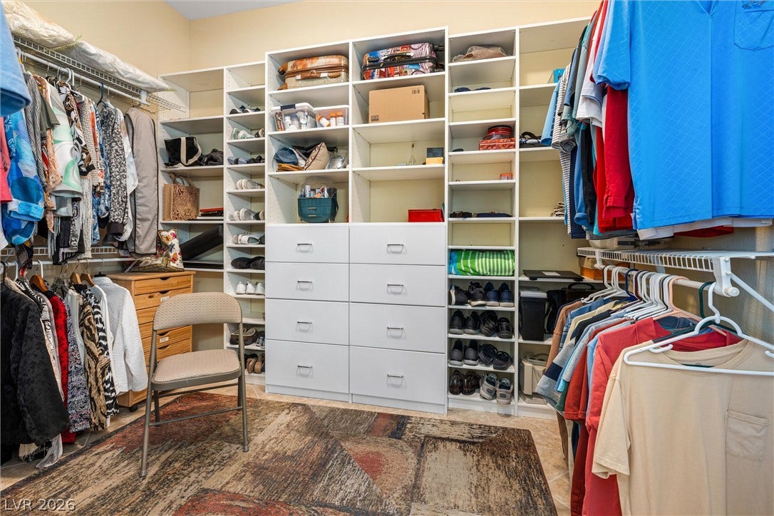 2107 Noah Tyler Ct., Henderson, NV 89052 Ample built-in shelving and custom drawers maximize organization in this spacious walk-in closet.