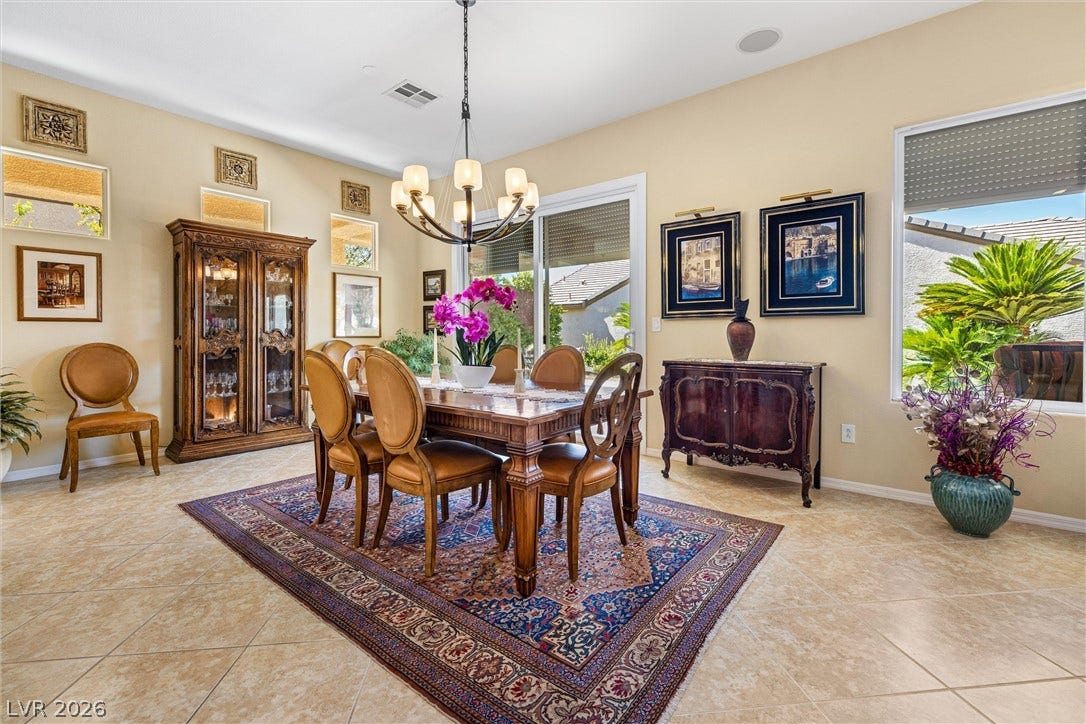 2107 Noah Tyler Ct., Henderson, NV 89052 Polished tile flooring and an elegant chandelier define this formal dining space.