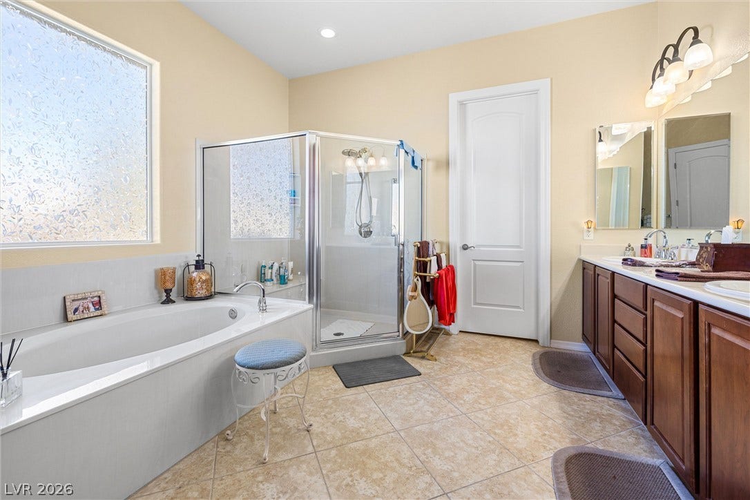 2107 Noah Tyler Ct., Henderson, NV 89052 A spacious layout highlights the separate soaking tub and glass-enclosed shower.