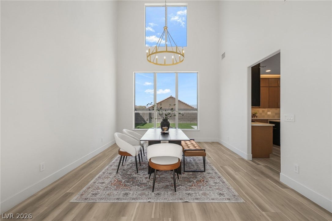 1287 Lime Point Street, Las Vegas, NV 89110 Towering ceilings and double-height windows elevate this formal dining space.