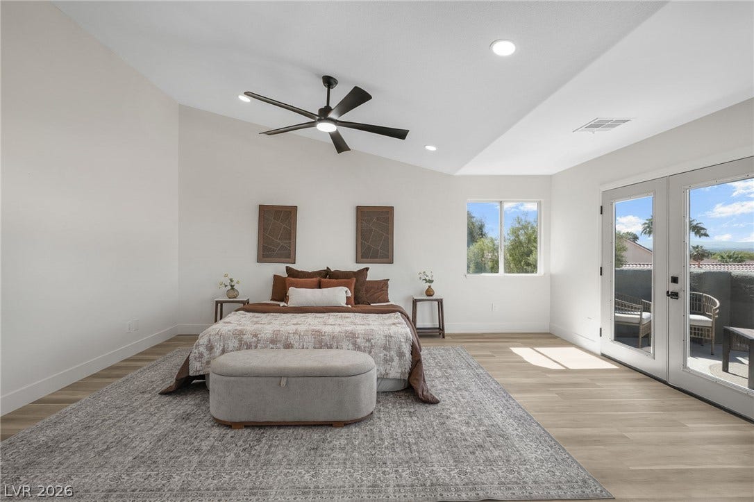 1287 Lime Point Street, Las Vegas, NV 89110 A spacious layout showcases vaulted ceilings and glass doors opening to a private balcony.