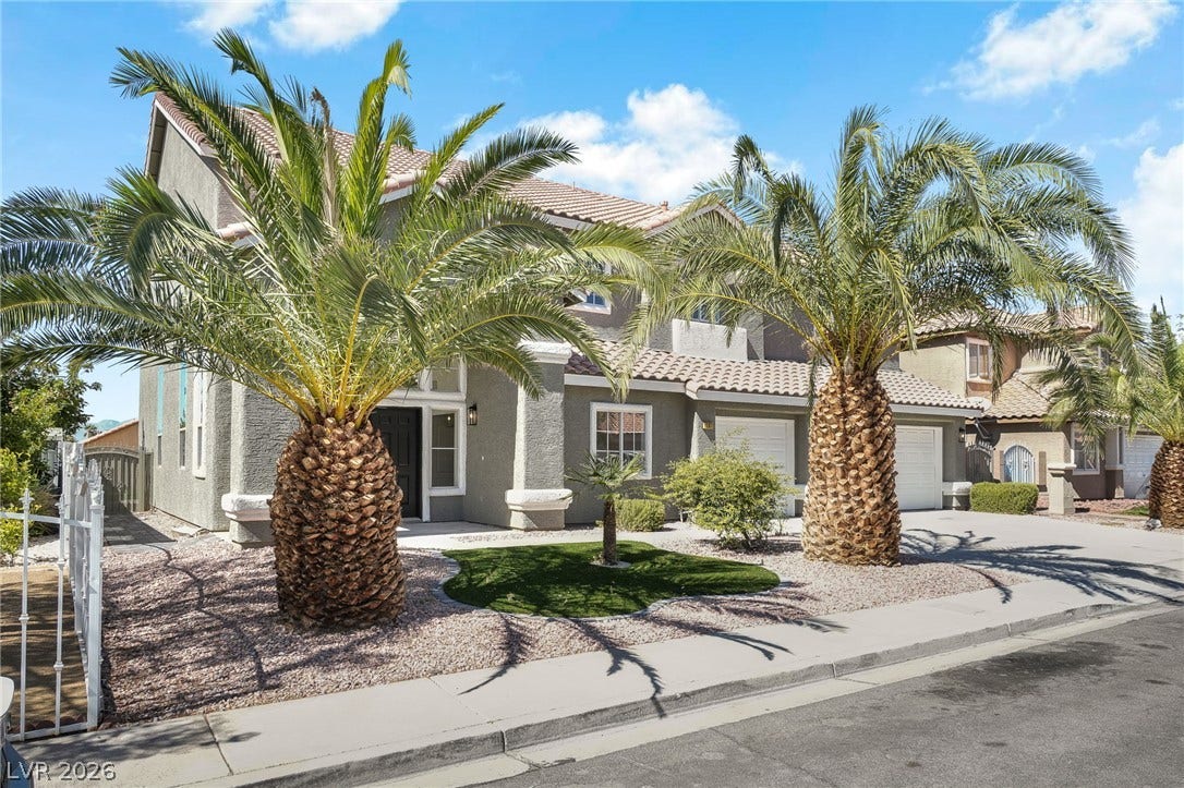 1287 Lime Point Street, Las Vegas, NV 89110 Palm trees frame the stucco exterior of this multi-level home with tile roofing.