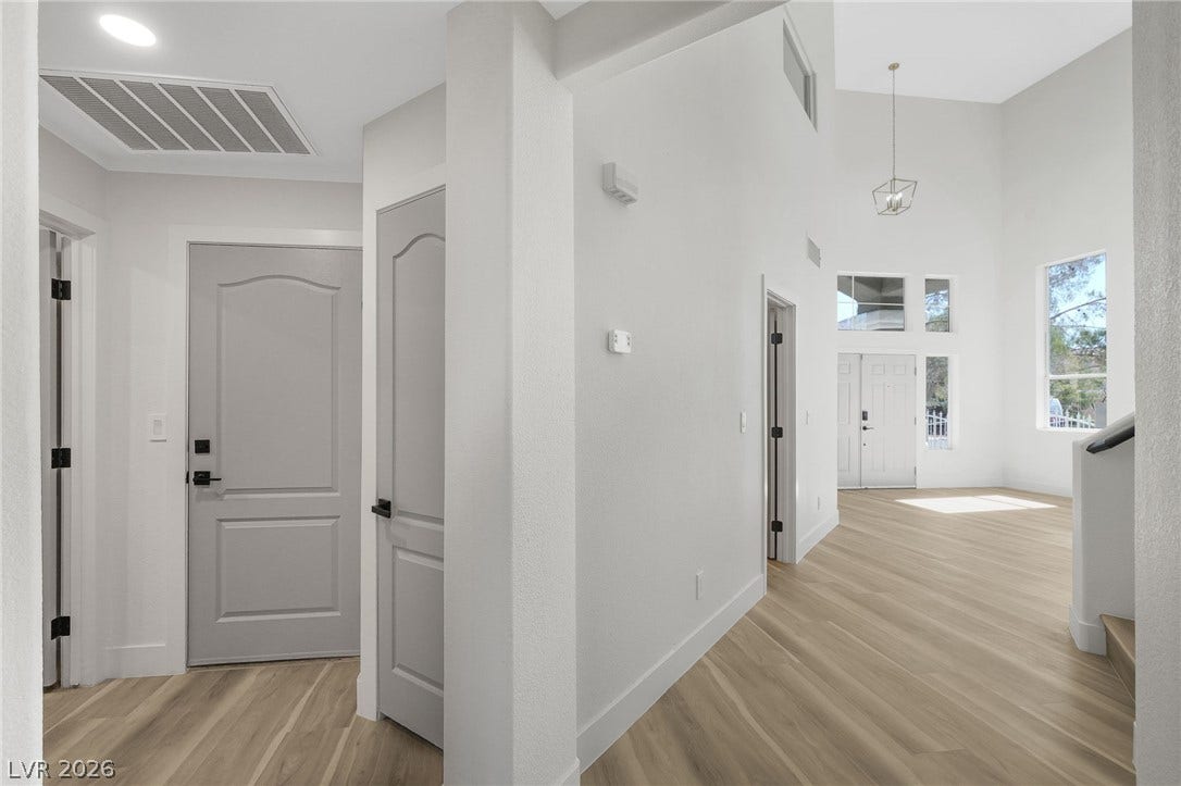 1287 Lime Point Street, Las Vegas, NV 89110 Light-toned wood flooring and soaring ceilings define this welcoming entrance foyer.