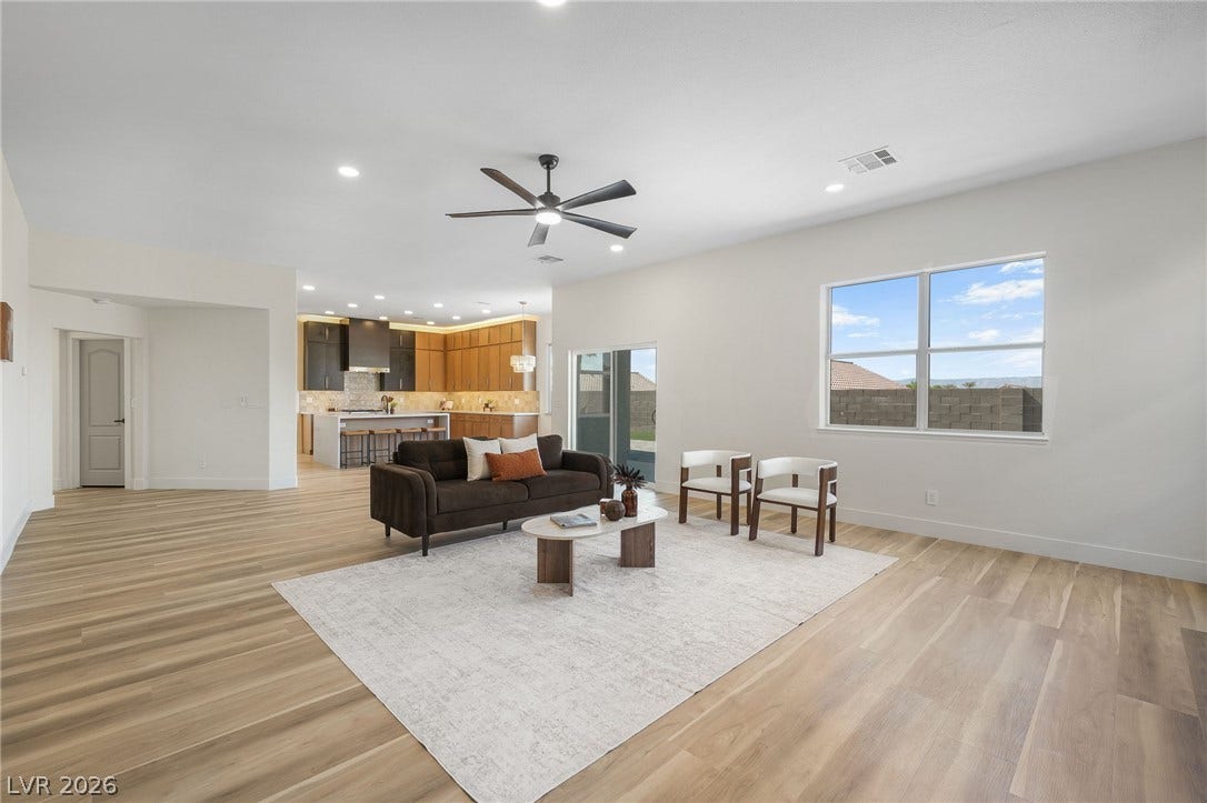 1287 Lime Point Street, Las Vegas, NV 89110 A spacious layout merges living and kitchen zones accented by sleek wood-look flooring.