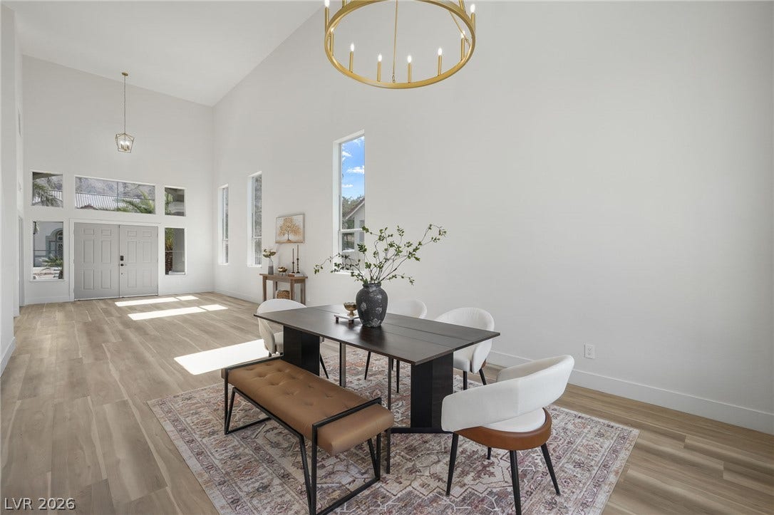1287 Lime Point Street, Las Vegas, NV 89110 Towering ceilings and clean lines define this airy dining space lined with wood flooring.