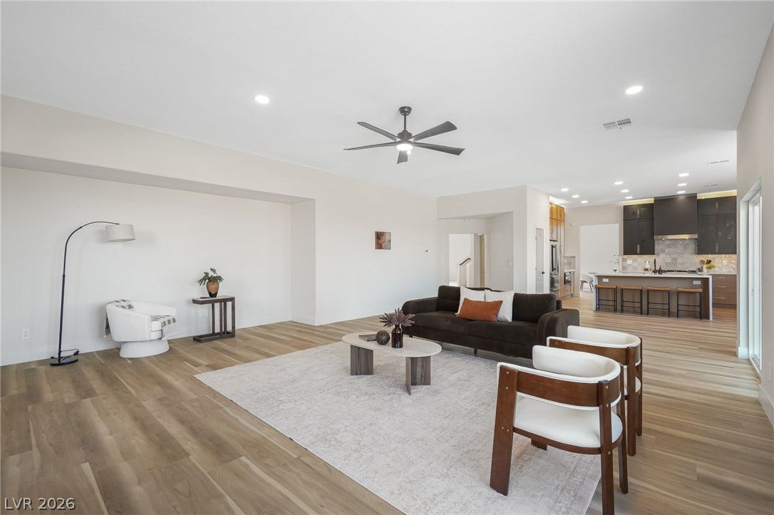1287 Lime Point Street, Las Vegas, NV 89110 An open floor plan seamlessly connects the main living space with the kitchen beyond.