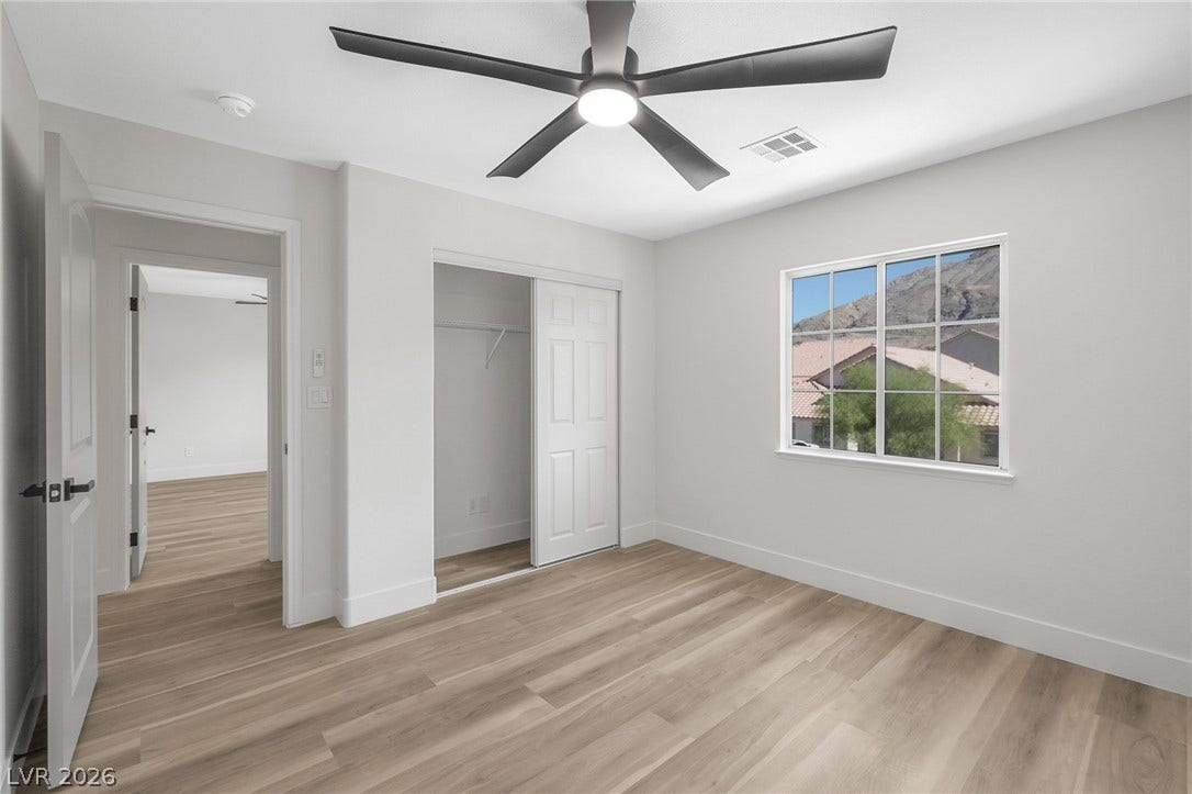 1287 Lime Point Street, Las Vegas, NV 89110 A sliding door closet and light wood-tone flooring complete this serene bedroom space.