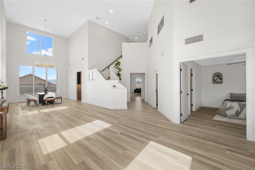 1287 Lime Point Street, Las Vegas, NV 89110 Soaring ceilings and warm wood floors define this light-filled, open-concept main level.