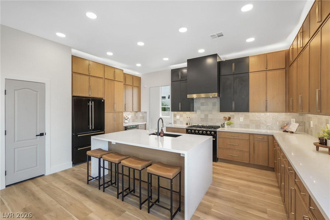 1287 Lime Point Street, Las Vegas, NV 89110 Smooth wood flooring and sleek solid-surface countertops anchor this modern culinary space.