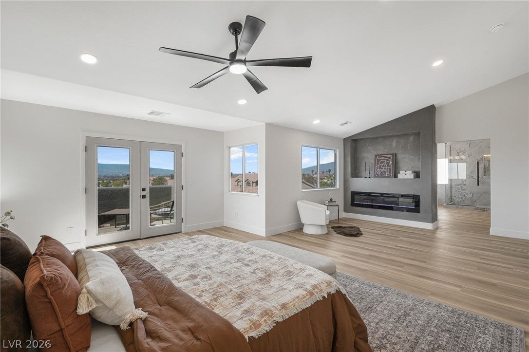 1287 Lime Point Street, Las Vegas, NV 89110 Vaulted ceilings and wide-plank wood flooring define this comfortable main-level bedroom suite.