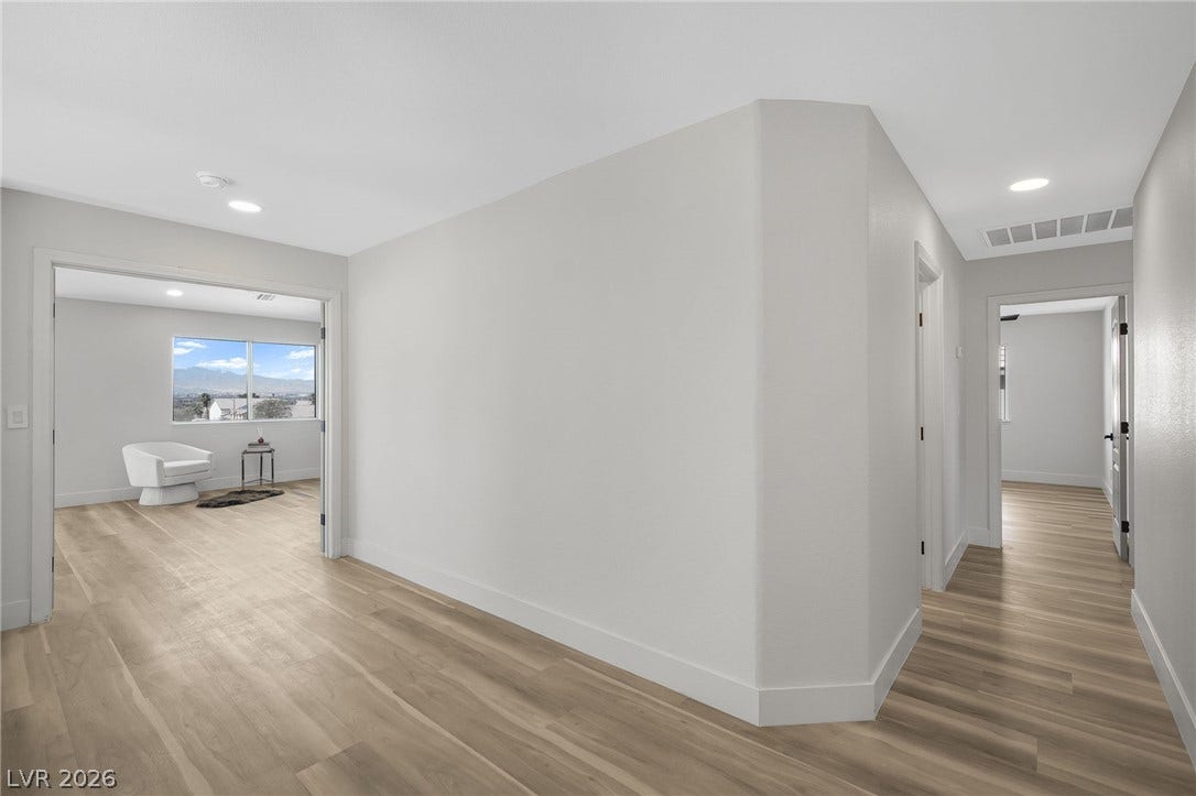1287 Lime Point Street, Las Vegas, NV 89110 Smooth wood flooring flows seamlessly through the bright hallways and adjacent living spaces.