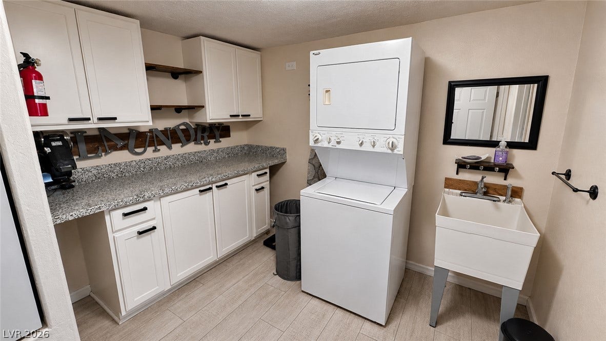 6130 Hawkins Way, Pahrump, NV 89061 Ample counter space and a deep utility sink highlight this functional laundry setup.