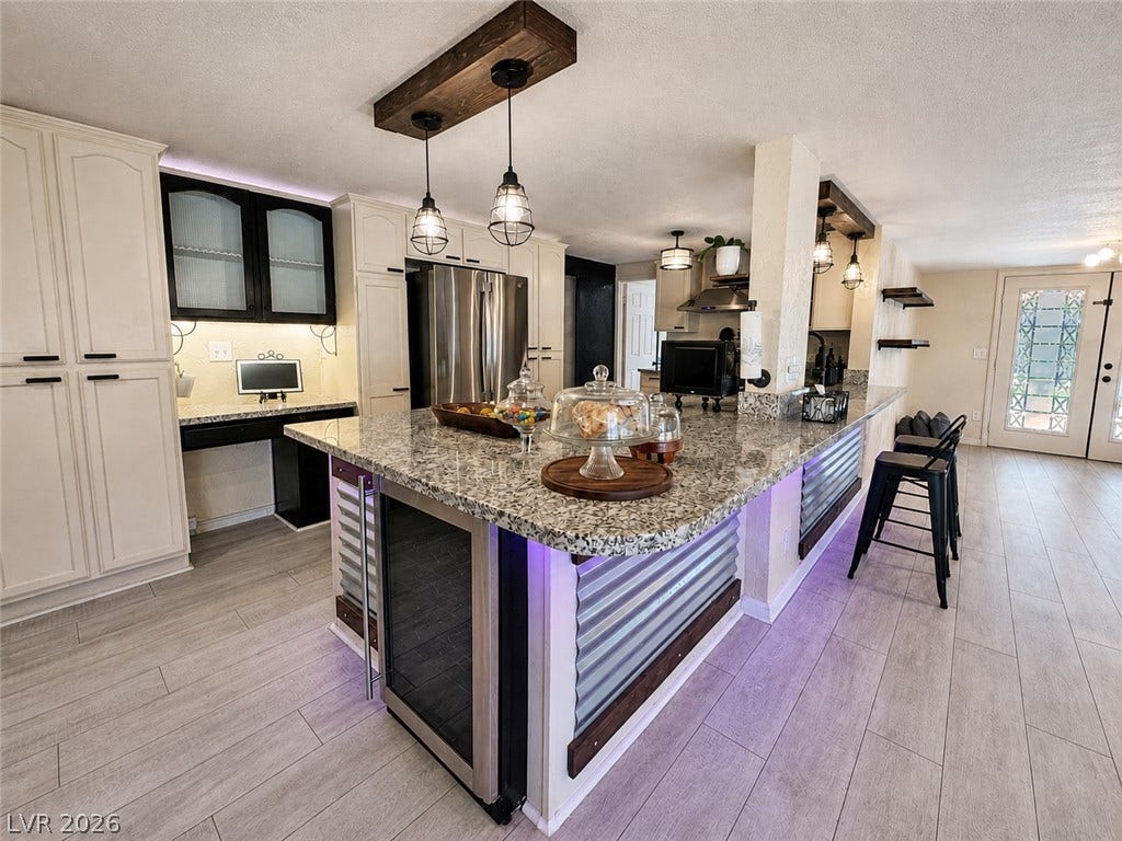 6130 Hawkins Way, Pahrump, NV 89061 Granite countertops and wood-look flooring anchor this spacious, well-appointed kitchen layout.
