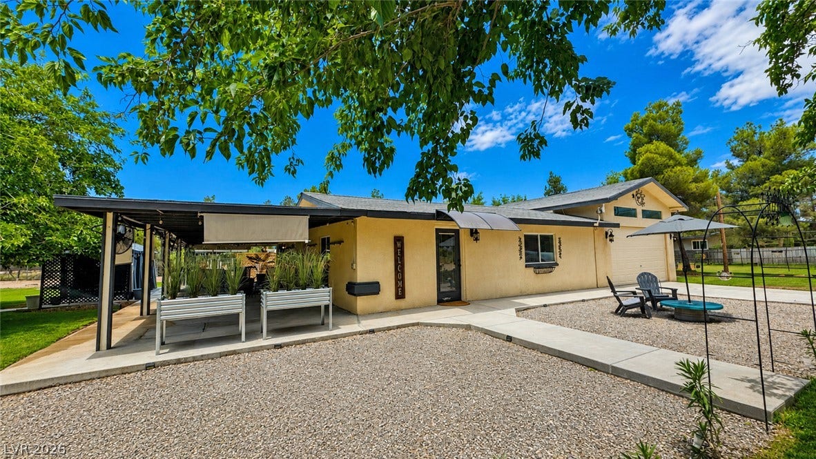 6130 Hawkins Way, Pahrump, NV 89061 A spacious concrete patio and covered terrace extend the outdoor living space of this property.