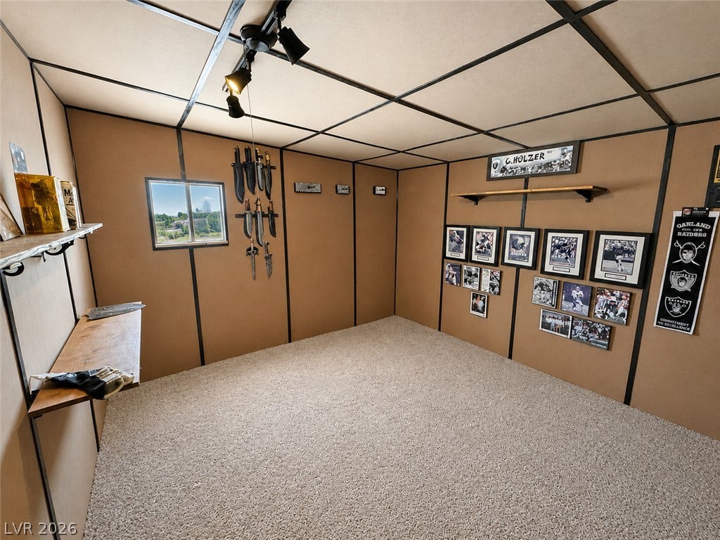 6130 Hawkins Way, Pahrump, NV 89061 Plush carpeting and paneled walls create a cozy, versatile bonus room.