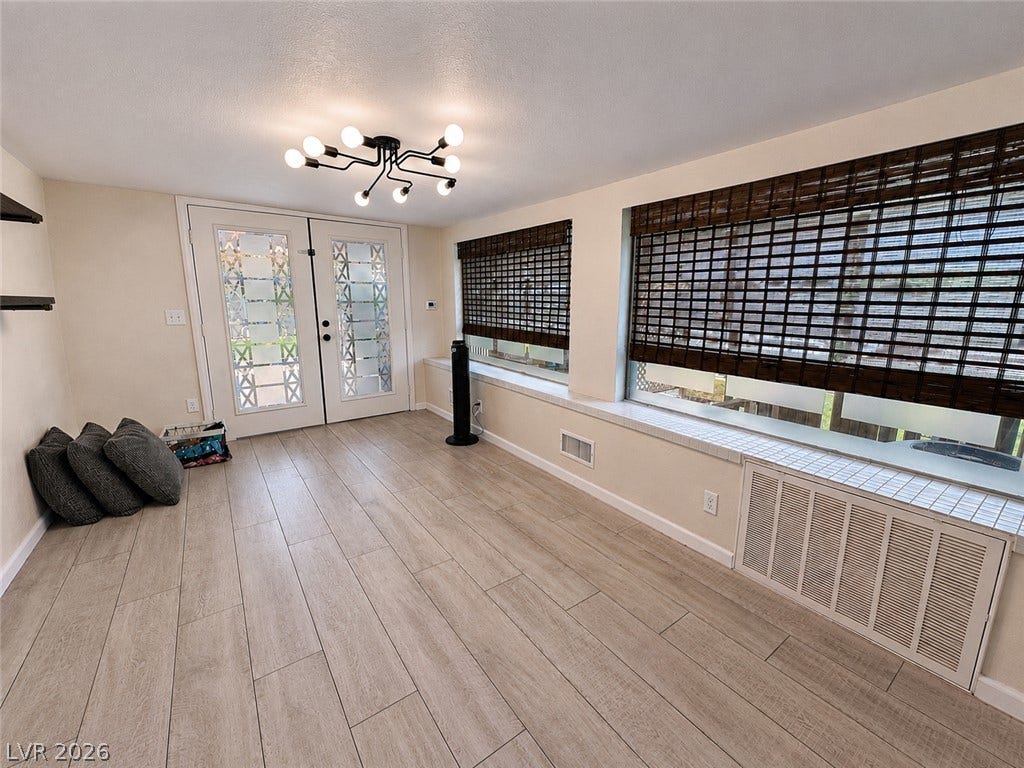 6130 Hawkins Way, Pahrump, NV 89061 Laminate flooring and built-in window seating anchor this versatile entry space.