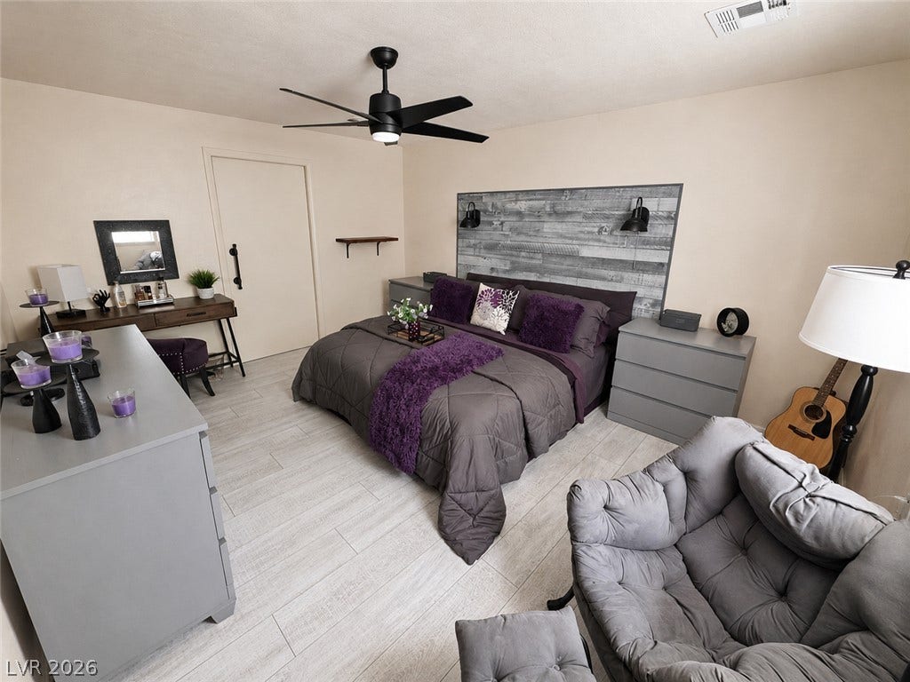 6130 Hawkins Way, Pahrump, NV 89061 Gleaming light wood flooring pairs beautifully with smooth, neutral-toned walls in this peaceful retreat.