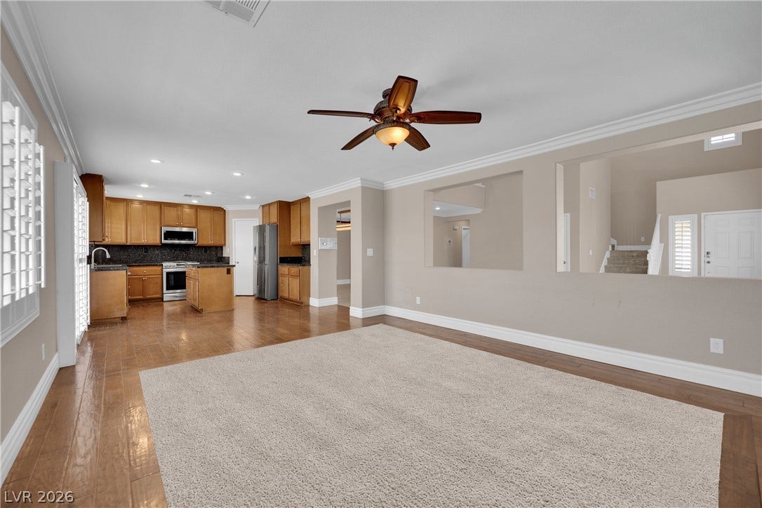10149 Whitney Falls Court, Las Vegas, NV 89148 Polished hardwood flooring and elegant crown molding define this open, airy living space.