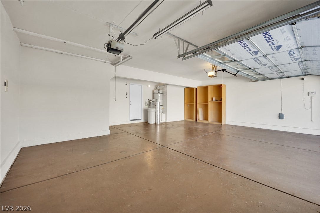 10149 Whitney Falls Court, Las Vegas, NV 89148 An accommodating multi-car garage provides extensive concrete flooring and integrated storage shelves.