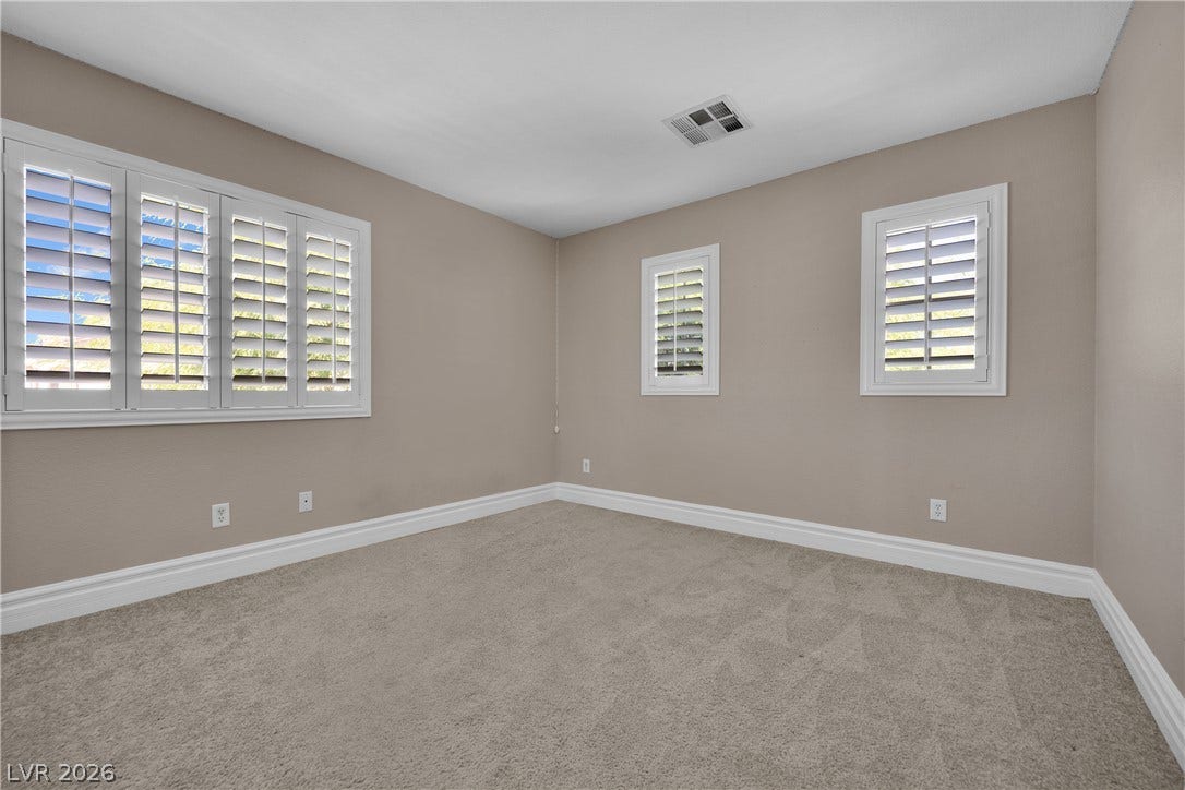 10149 Whitney Falls Court, Las Vegas, NV 89148 Plush carpeting underfoot complements the crisp plantation shutters inside this versatile space.