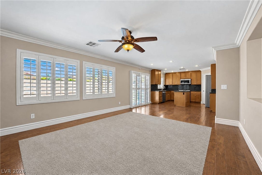 10149 Whitney Falls Court, Las Vegas, NV 89148 Gleaming hardwood floors and classic crown molding anchor this open-concept main level.