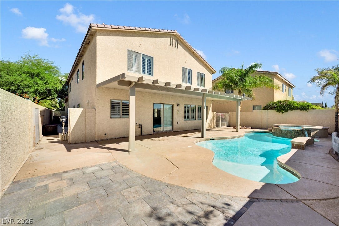 10149 Whitney Falls Court, Las Vegas, NV 89148 A sparkling swimming pool highlights this backyard oasis with a covered patio area.