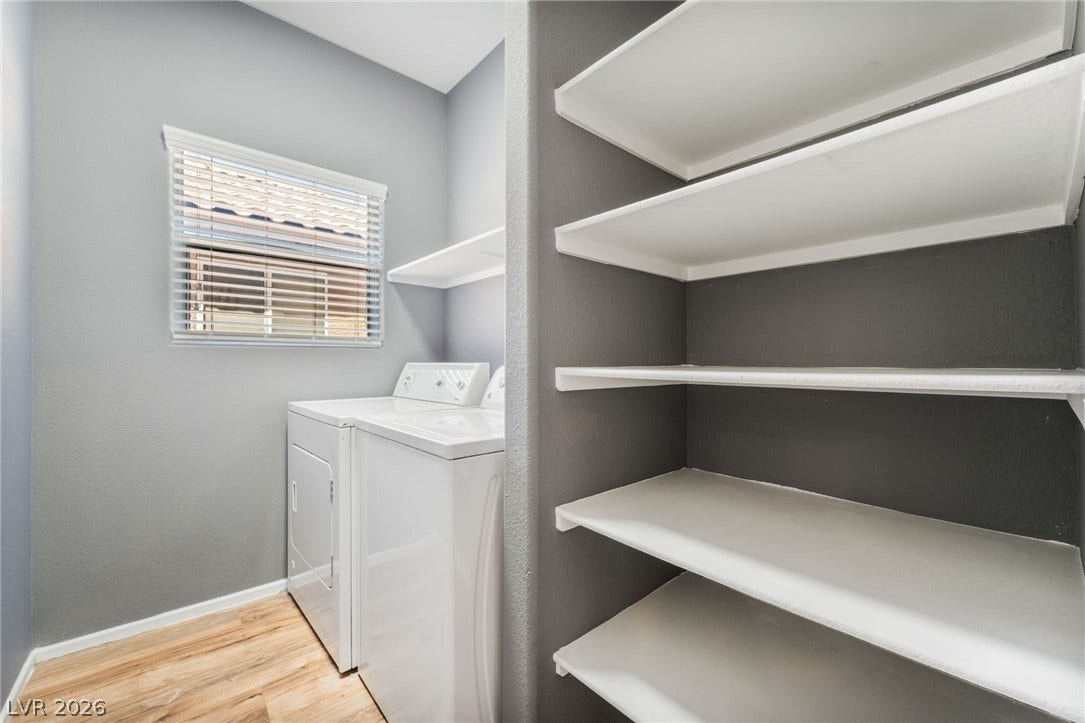 2825 Woodland Park Avenue, North Las Vegas, NV 89086 Functional utility space includes built-in shelving alongside laundry hookups and a window.