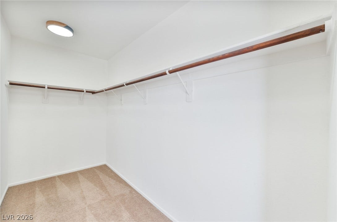 2825 Woodland Park Avenue, North Las Vegas, NV 89086 Generous closet space features wrap-around hanging rods and neutral carpeting.