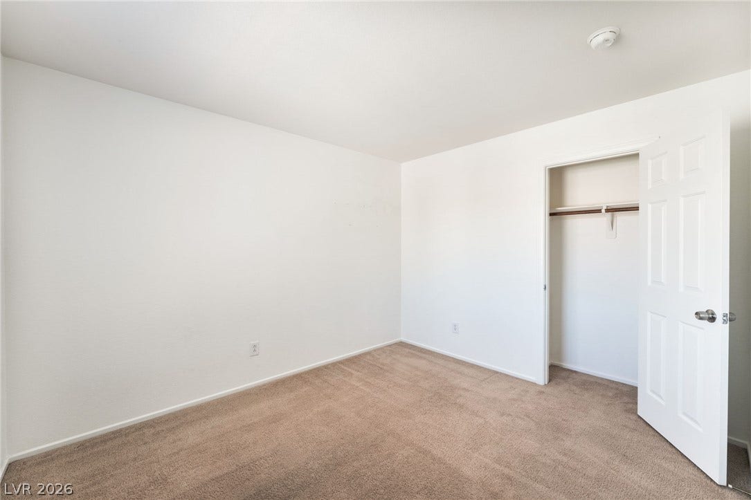 2825 Woodland Park Avenue, North Las Vegas, NV 89086 Soft carpeting pairs with smooth neutral walls in this versatile bedroom space.