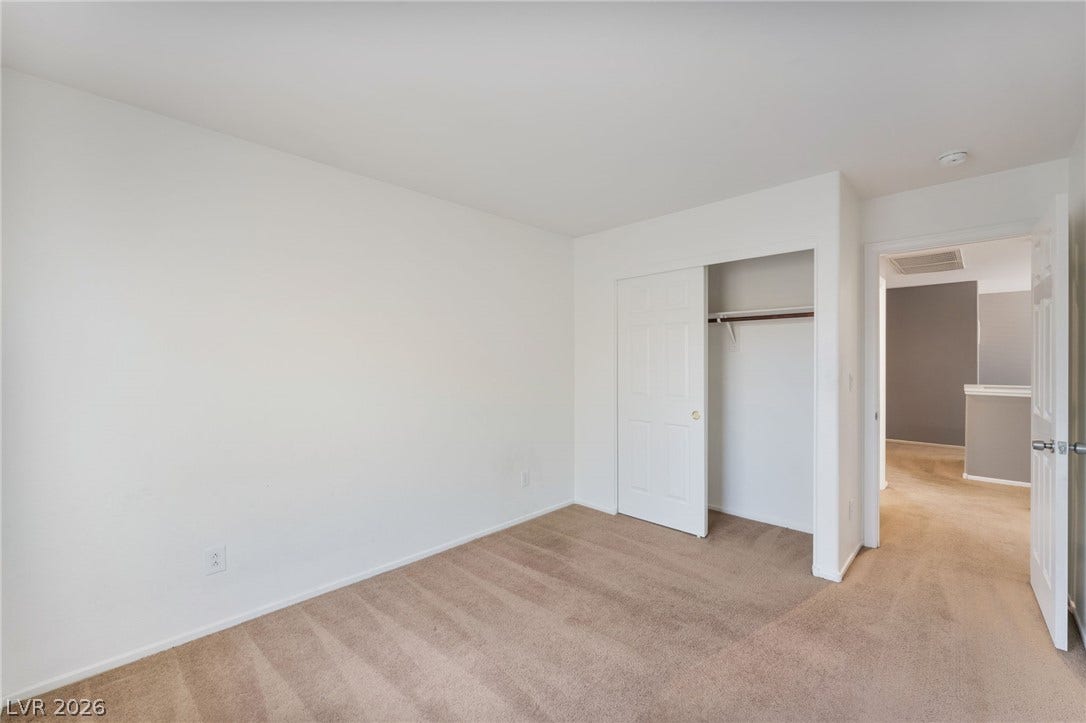 2825 Woodland Park Avenue, North Las Vegas, NV 89086 Plush carpeting and clean lines define this versatile bedroom with an integrated closet.