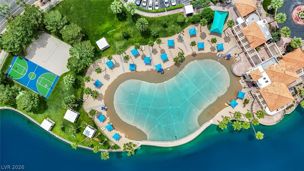 A magnificent resort-style lagoon pool and recreation courts sit nestled alongside sparkling waterfront views.